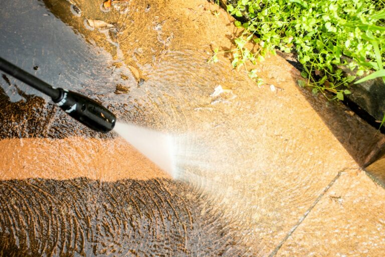 Cleaning backyard with pressure washer clelaner. Spring clean up